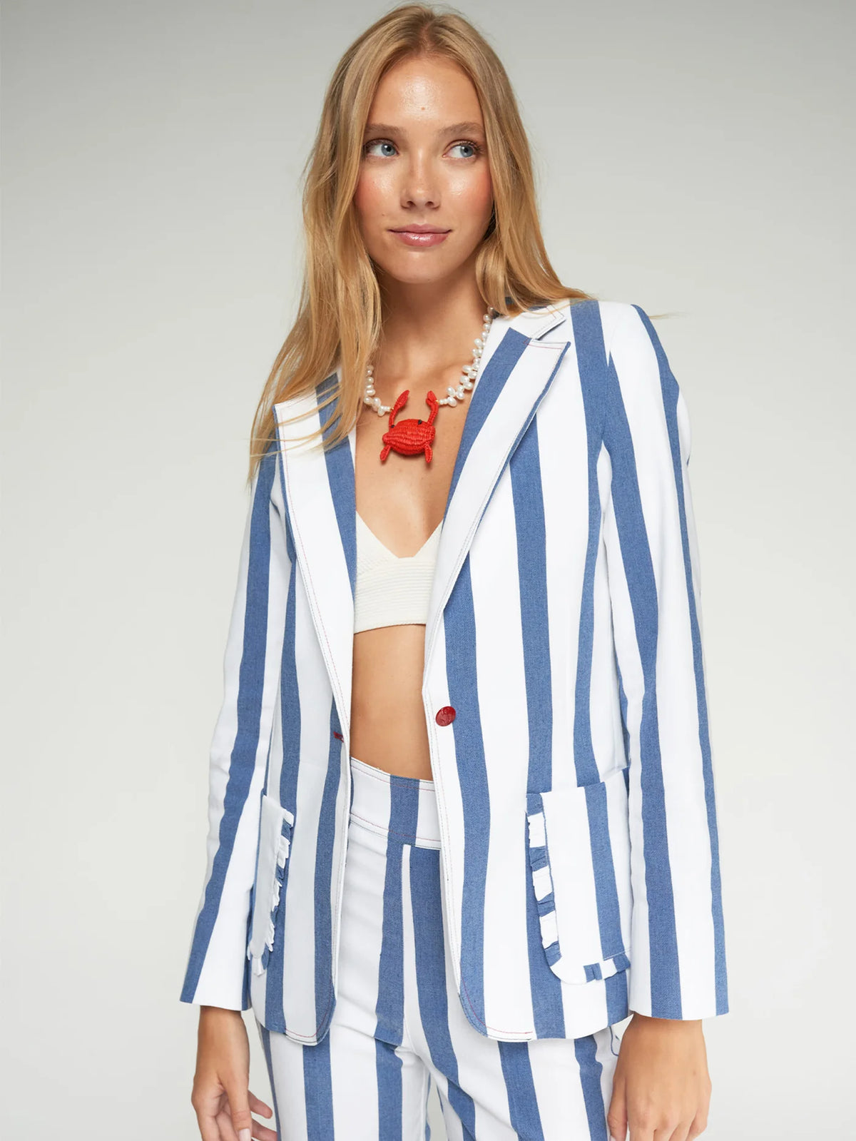 Blue and white striped jacket with pockets and ruffles